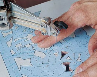 a person using scroll saw blade